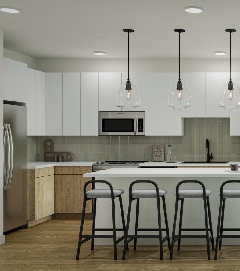 Modern kitchen and living room with an island, pendant lights, sofa, art, and large window.