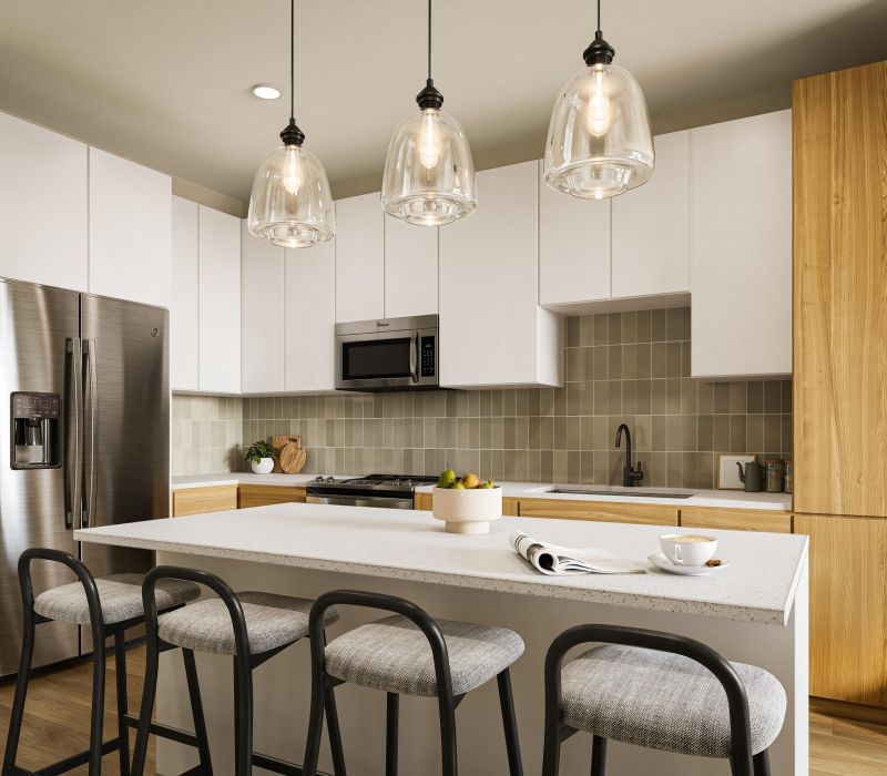 Modern kitchen with an island, pendant lights, white cabinets, wood accents, and stainless steel appliances.